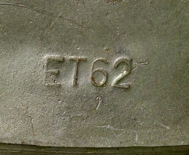 The manufacturer code is stamped on the inner rim on the left side close to the chinstrap bale. ET is the abbreviation for Eisenhüttenwerke - Thale (later ckl and CKL) who manufactured M35, M40 and M42 models. The number 