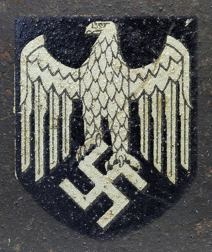 ET decal from an M42. Note the backing of the decal (visible on the left edge) that has the same silver color as the eagle itself.