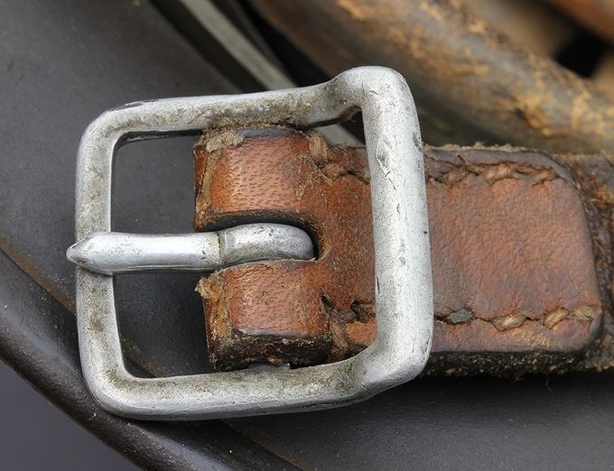 Early chinstrap aluminum buckle on an M35. 