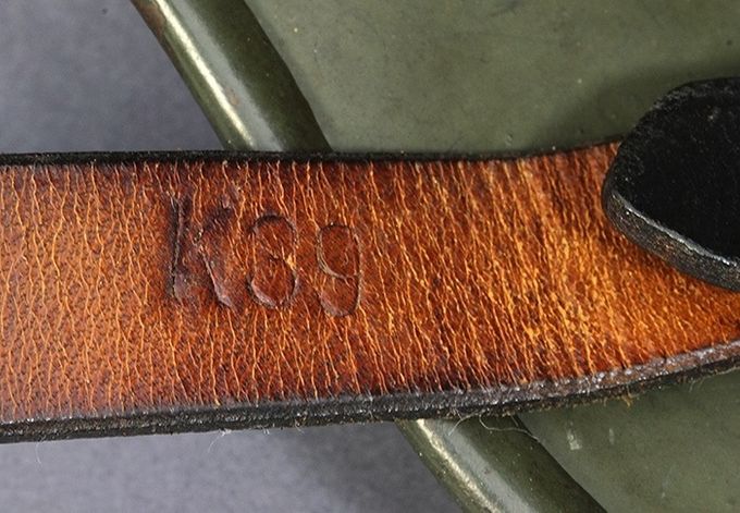 K39 stamp on the long part of the chinstrap near the retaining stud.