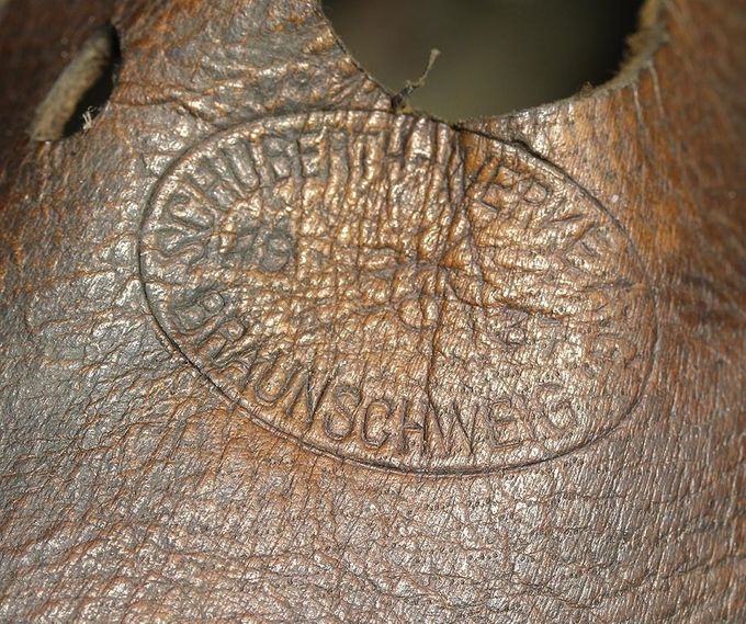 Early manufacturer stamp embossed in the leather liner of a WW1 transitional helmet. Schubert-Werke K.G., Braunschweig 1937.