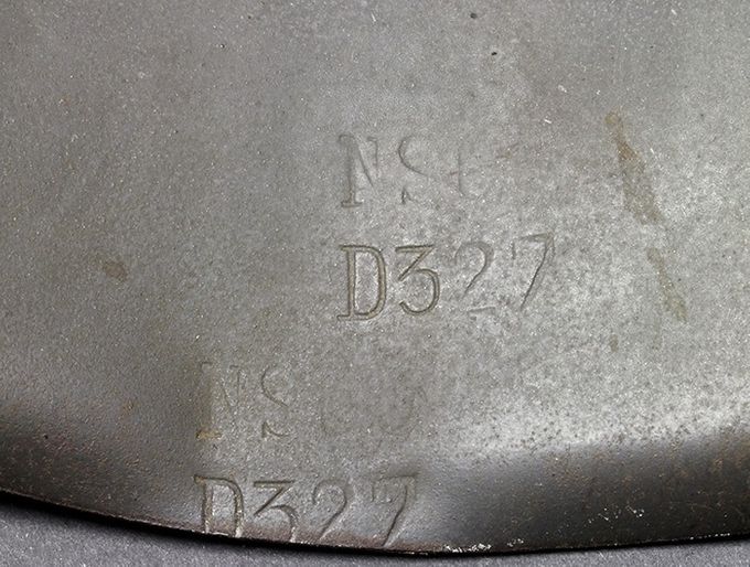 A double stamping in an M42 NS. Notice the dent in the soft steel of the rim.
