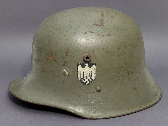 M17 Austrian-manufactured helmet. Notice the high position of the chinstrap lug just below the right side of the decal. This decal is an early type with faded lines in the eagle. The paint is an early smooth type (Lars Aasen collection).