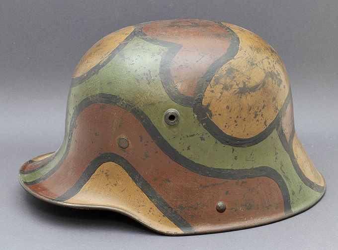 M17 Si66 (Eisenhütte Silesia, Paruschowitz Oberschlesien). Painted in the classic colors of ochre, red-brown and green divided by black lines. This camouflage scheme is often seen in period pictures. Purchased in the USA.