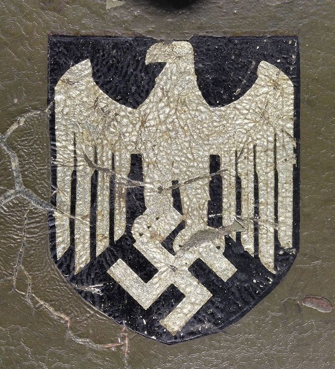 Heer decal on an M16/M17 “ transitional” helmet. This decal is an early type commonly seen on transitional helmets. Notice the faint lines in the eagle which has worn over time. The cracking on the left side of the decal is due to a Reichswehr decal beneath the last paint layer.