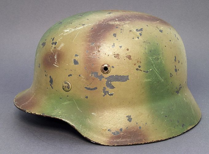 M35 Q66 LW sprayed in a tan base color with green and brown patterns over top. 