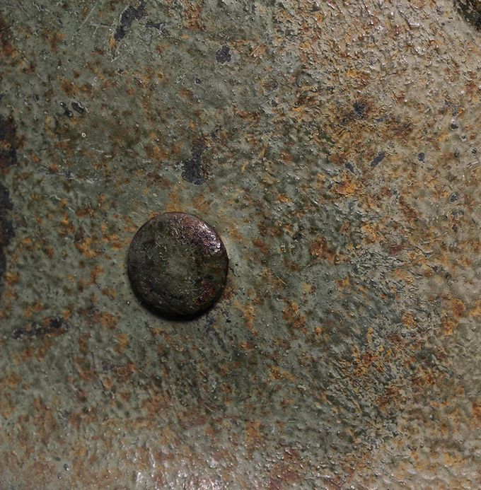 Close-up picture of one of the rivet heads.